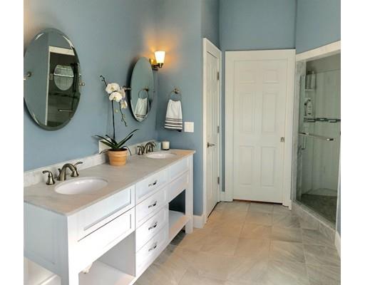 85 Morningside Road Needham, MA 02492 - Photo 17 of 27 a bathroom with a double vanity sink mirror and bathtub