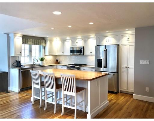 85 Morningside Road Needham, MA 02492 - Photo 3 of 27 a kitchen with stainless steel appliances granite countertop a refrigerator a stove a sink dishwasher and white cabinets with wooden floor