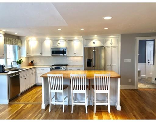 85 Morningside Road Needham, MA 02492 - Photo 4 of 27 a kitchen with a dining table chairs and granite kitchen