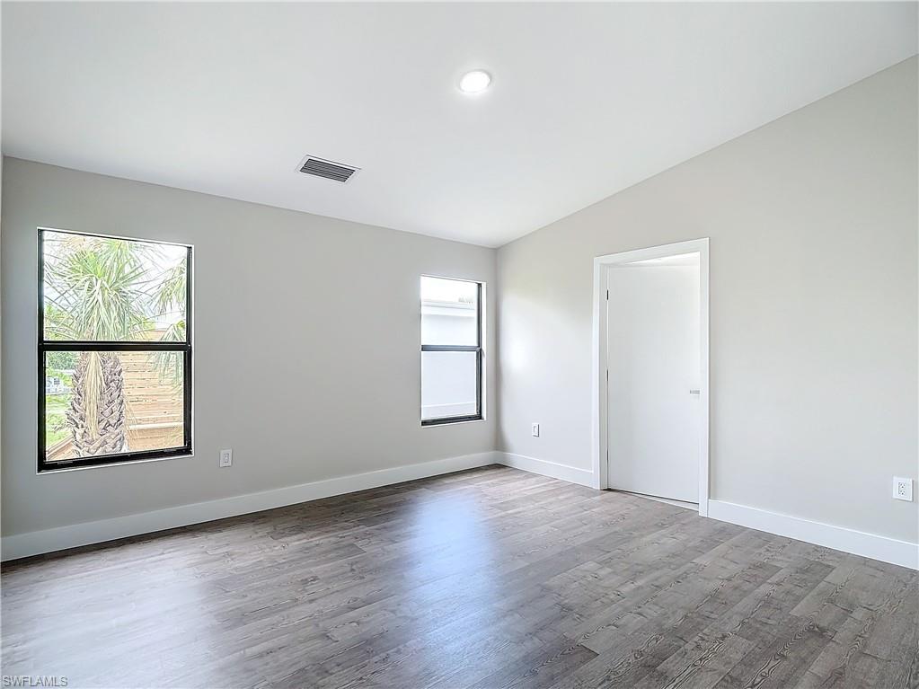 2505 Storter Avenue Naples, FL 34112 - Photo 22 of 49 an empty room with windows and closet