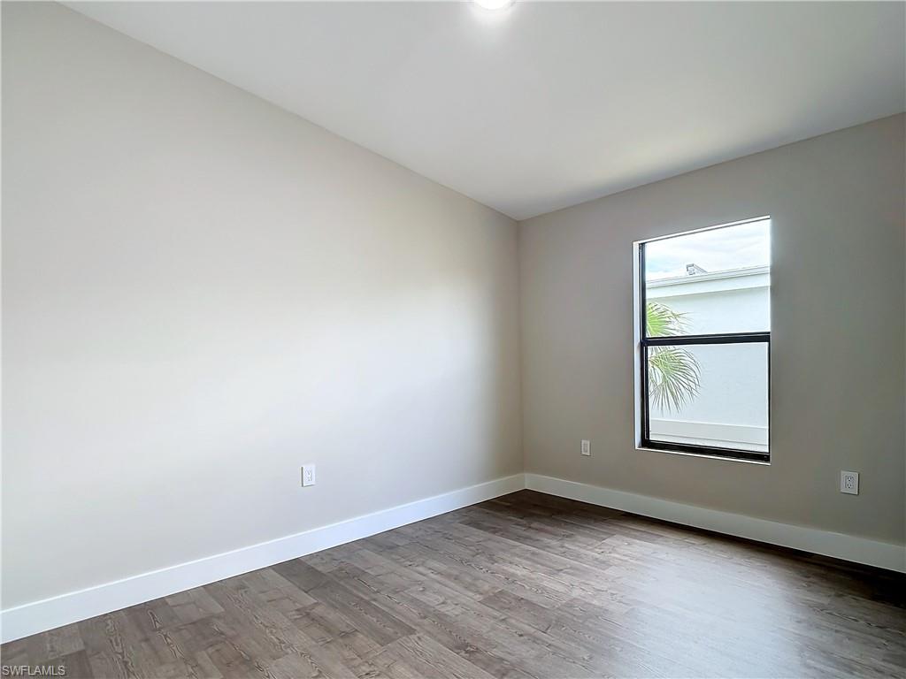 2505 Storter Avenue Naples, FL 34112 - Photo 27 of 49 an empty room with a window