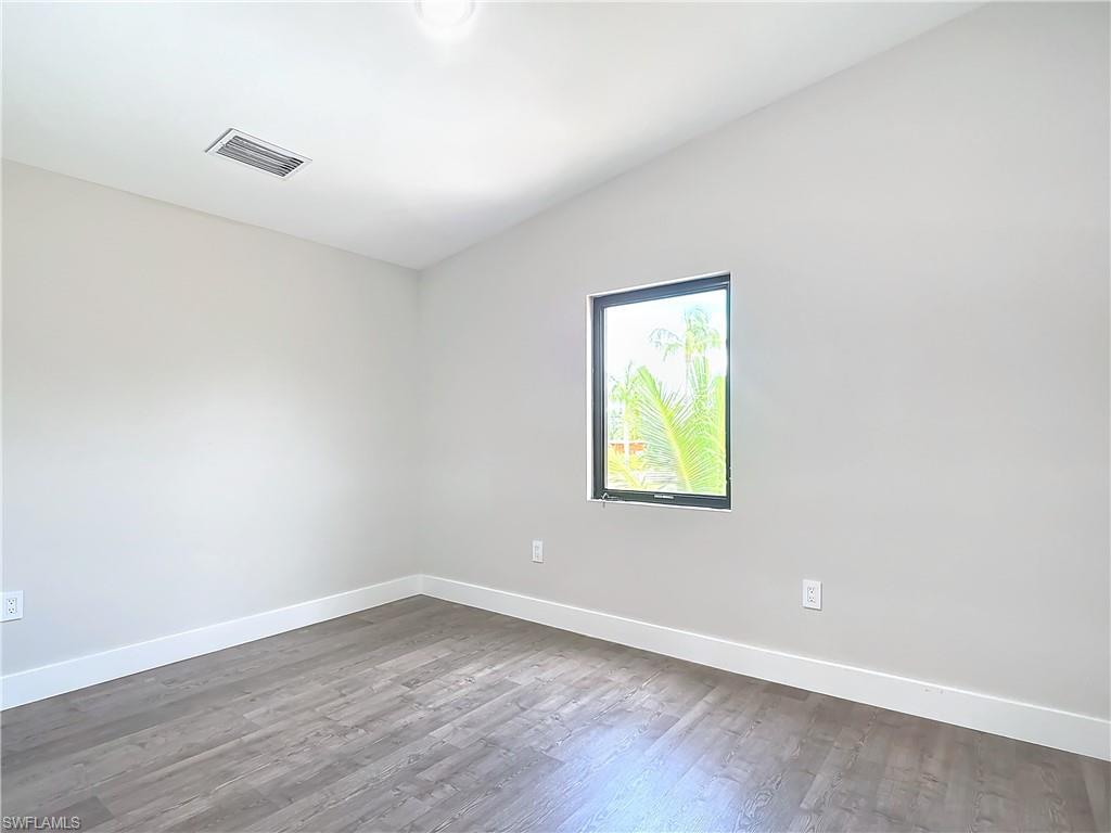 2505 Storter Avenue Naples, FL 34112 - Photo 30 of 49 an empty room with a window