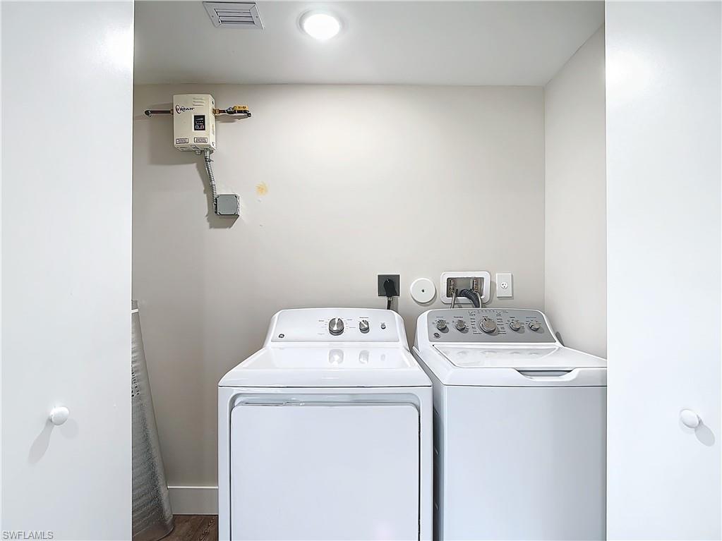 2505 Storter Avenue Naples, FL 34112 - Photo 38 of 49 a utility room with dryer and washer