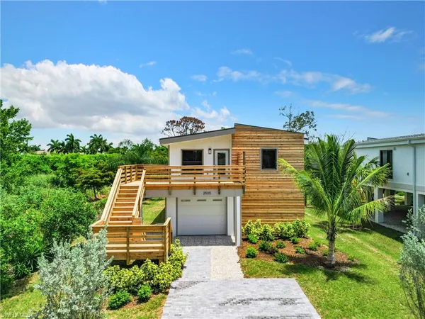 a aerial view of a house with a yard