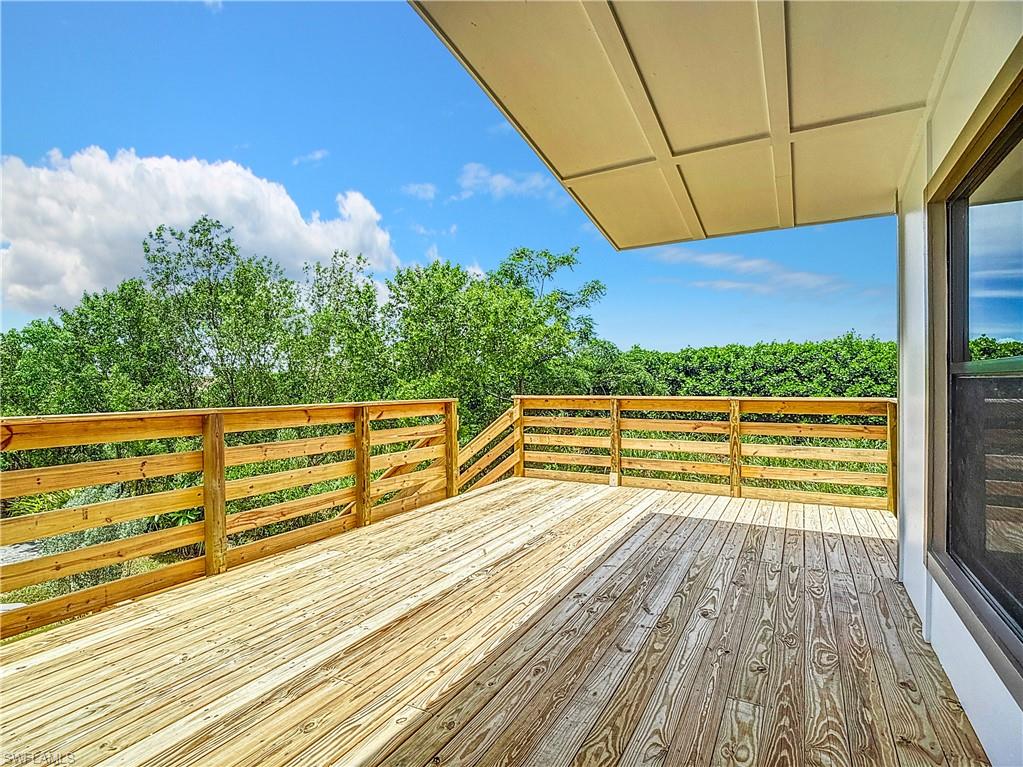 2505 Storter Avenue Naples, FL 34112 - Photo 46 of 49 a view of a balcony with wooden floor and fence
