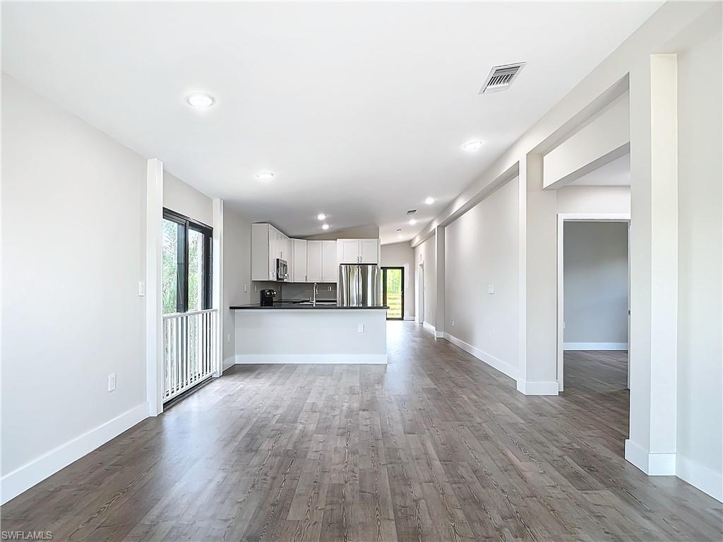 2505 Storter Avenue Naples, FL 34112 - Photo 6 of 49 a view of kitchen and wooden floor