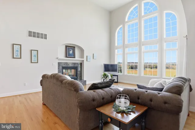 a kitchen with stainless steel appliances granite countertop a sink a stove and cabinets