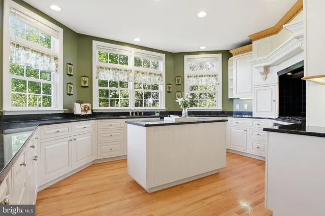 a bathroom with a sink vanity and a mirror