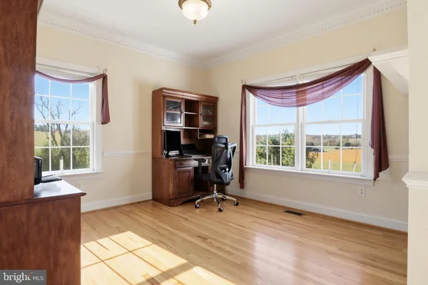a view of walk in closet with clothes