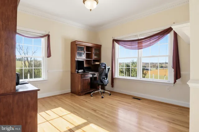 a view of walk in closet with clothes