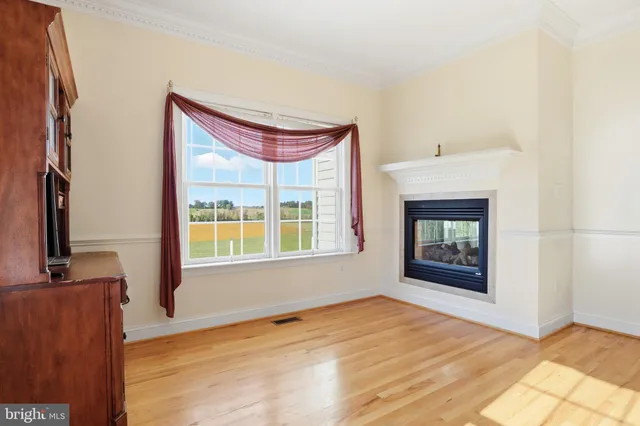 a bathroom with a toilet sink vanity and mirror
