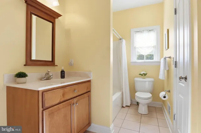 a room with pool table and a chandelier