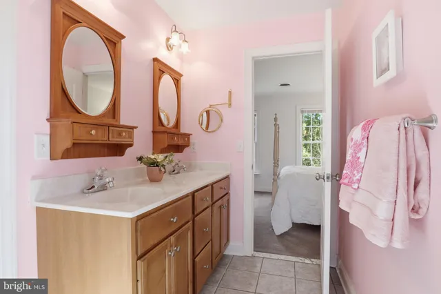 a view of a balcony with wooden floor and outdoor seating