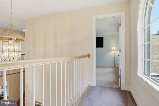 a view of a two chairs and table in the garden