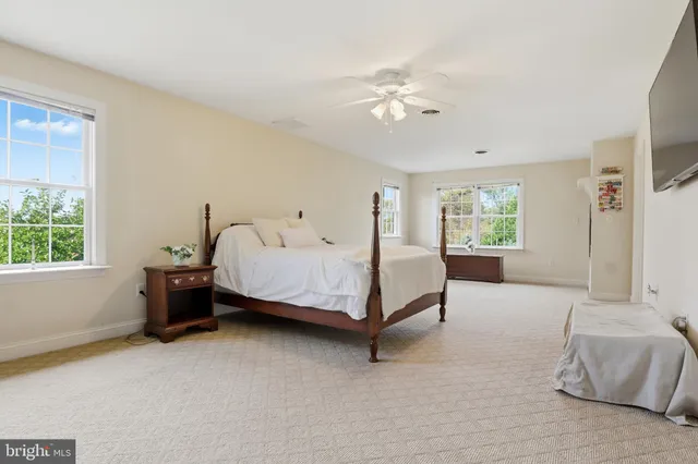 a view of a garden with a building in the background