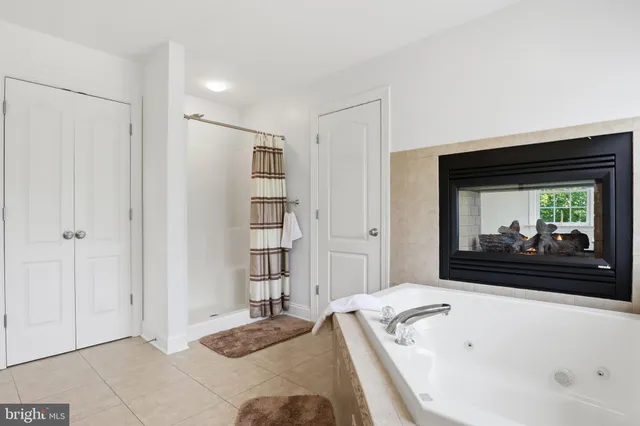 a view of a garden with a house in the background