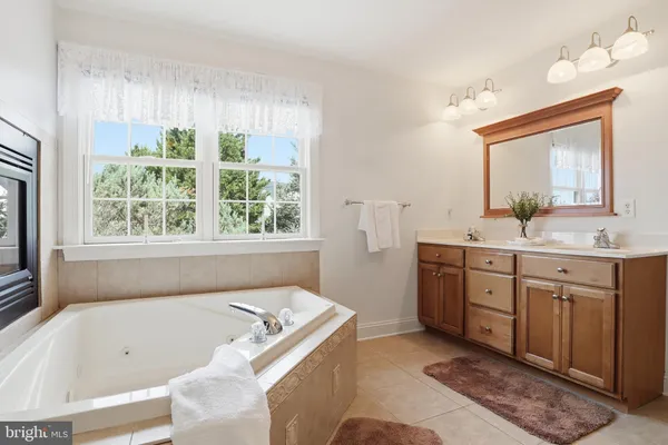 an aerial view of a houses with outdoor space and lake view