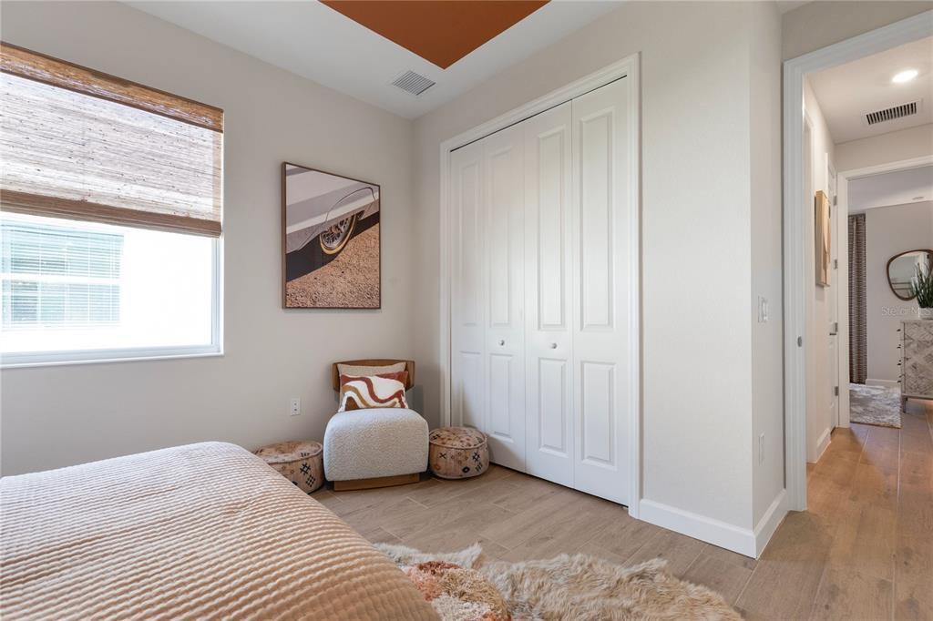 7157 Inlet Isles Lakewood Ranch, FL 34202 - Photo 21 of 26 a bedroom with a bed and a window