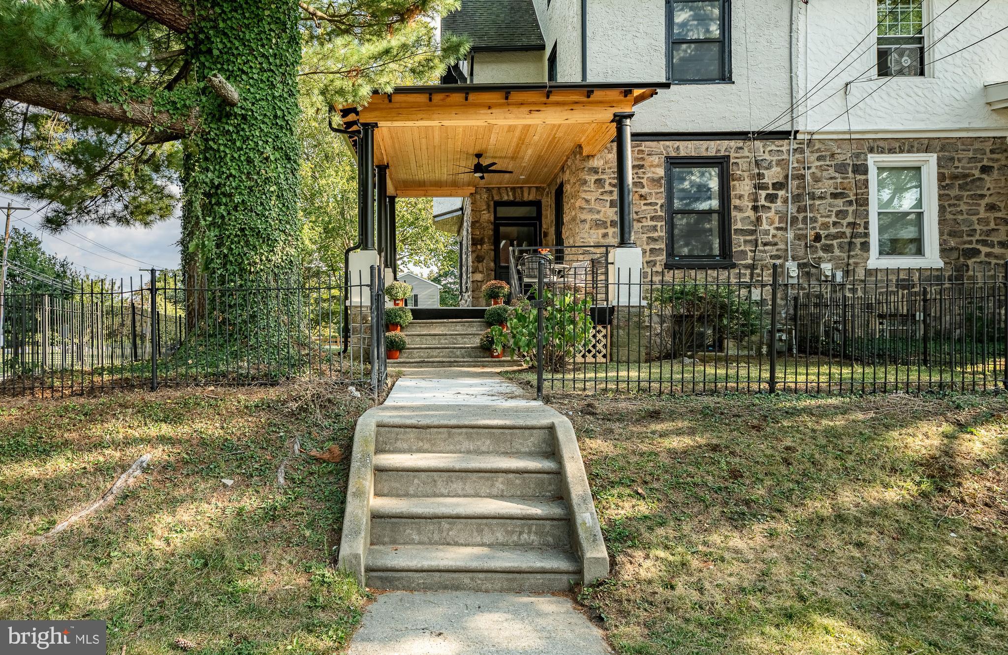101 Grandview Road Ardmore, PA 19003 - Photo 2 of 55 a view of a house with a small yard and plants
