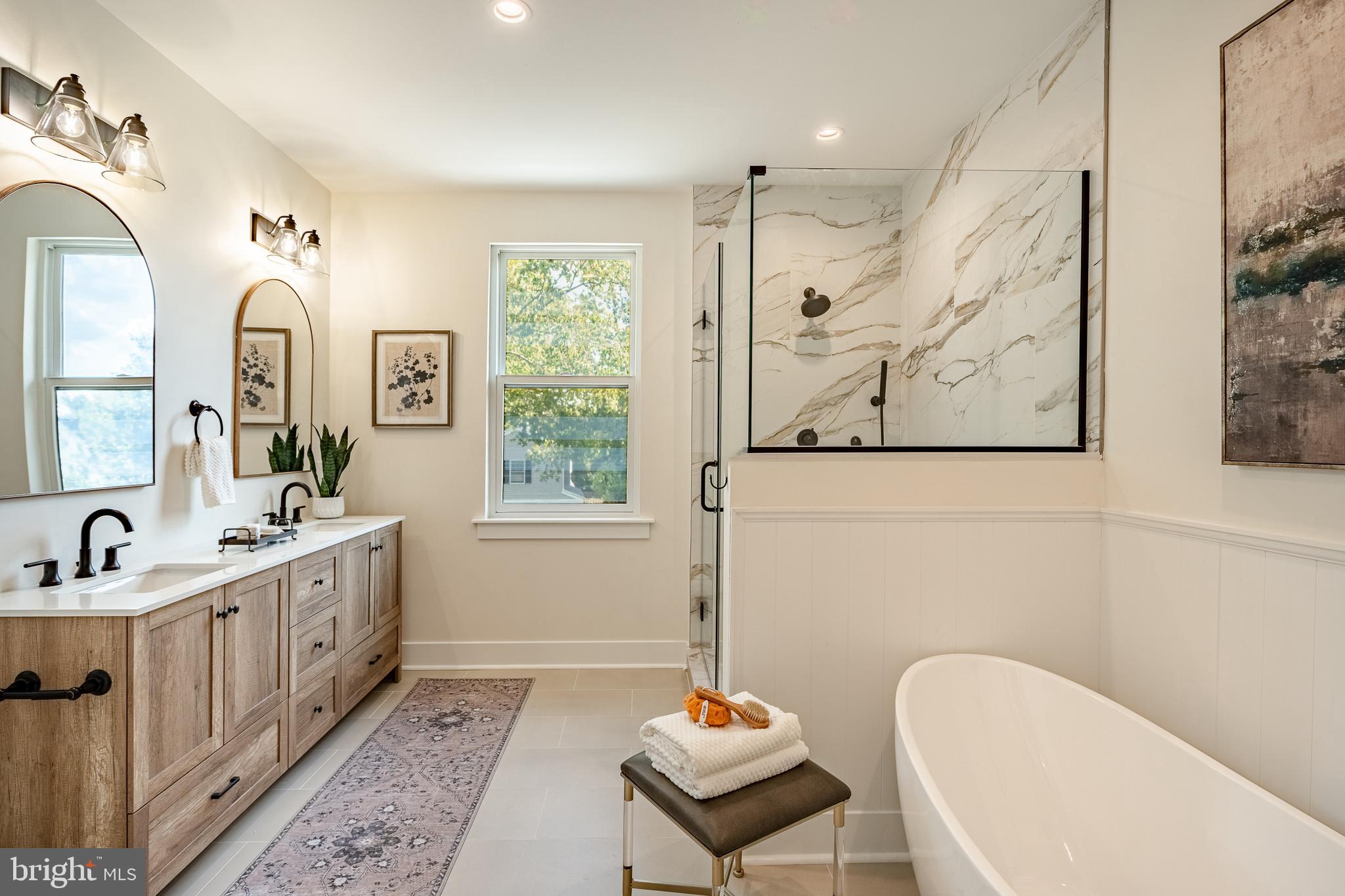 101 Grandview Road Ardmore, PA 19003 - Photo 37 of 55 a spacious bathroom with sink mirror and bathtub