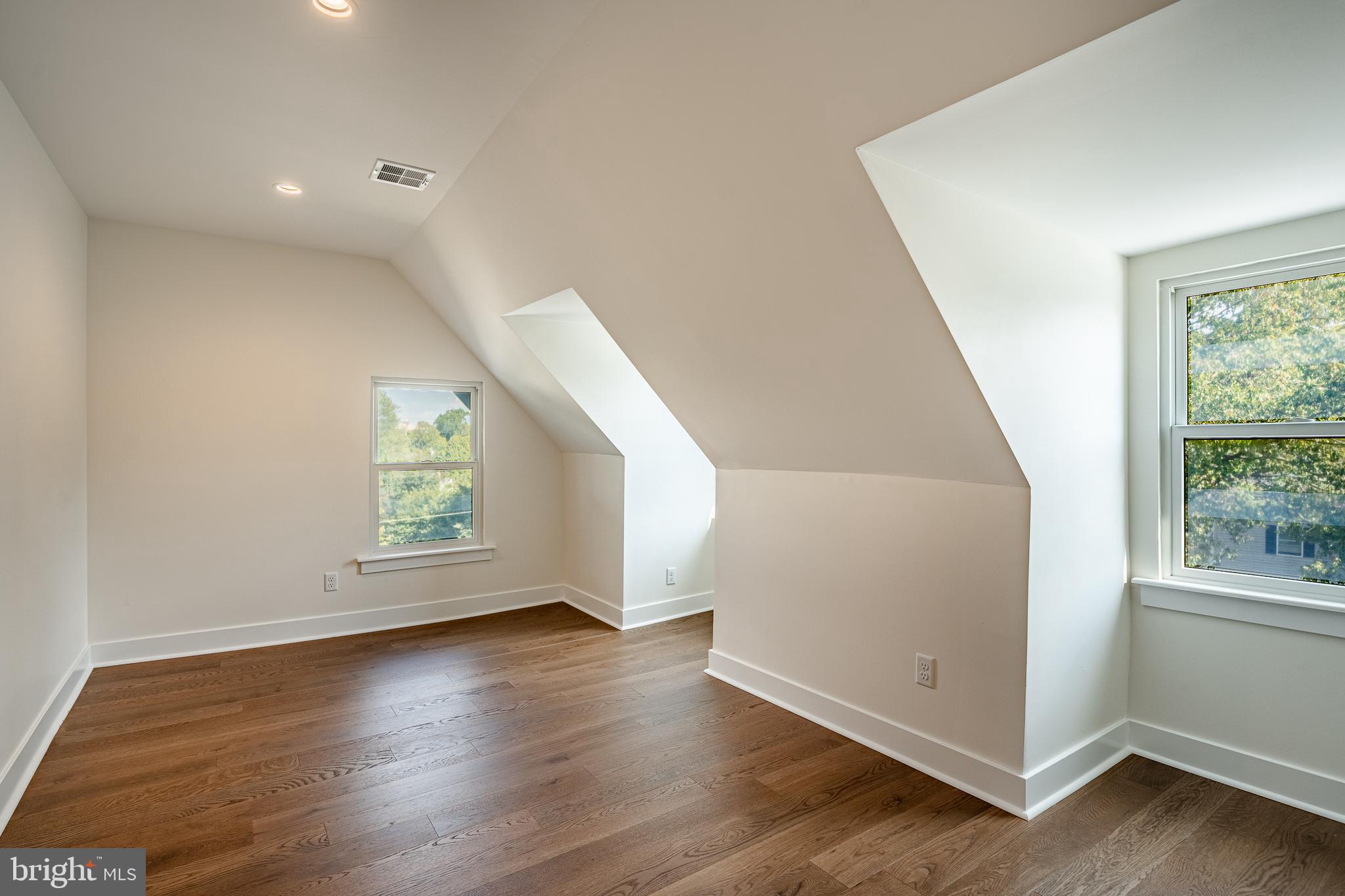 101 Grandview Road Ardmore, PA 19003 - Photo 45 of 55 an empty room with wooden floor and windows