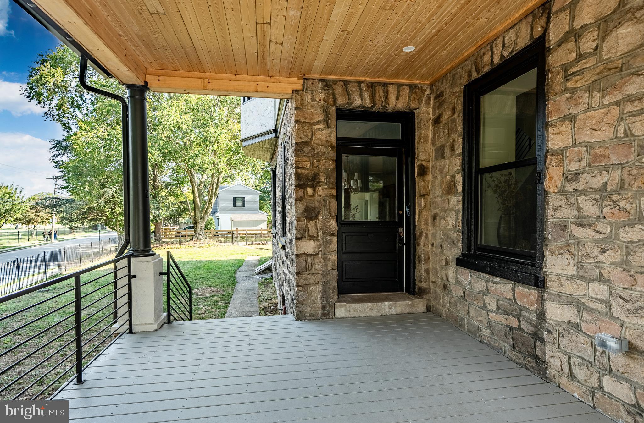 101 Grandview Road Ardmore, PA 19003 - Photo 5 of 55 a view of a porch with wooden floor and outdoor space