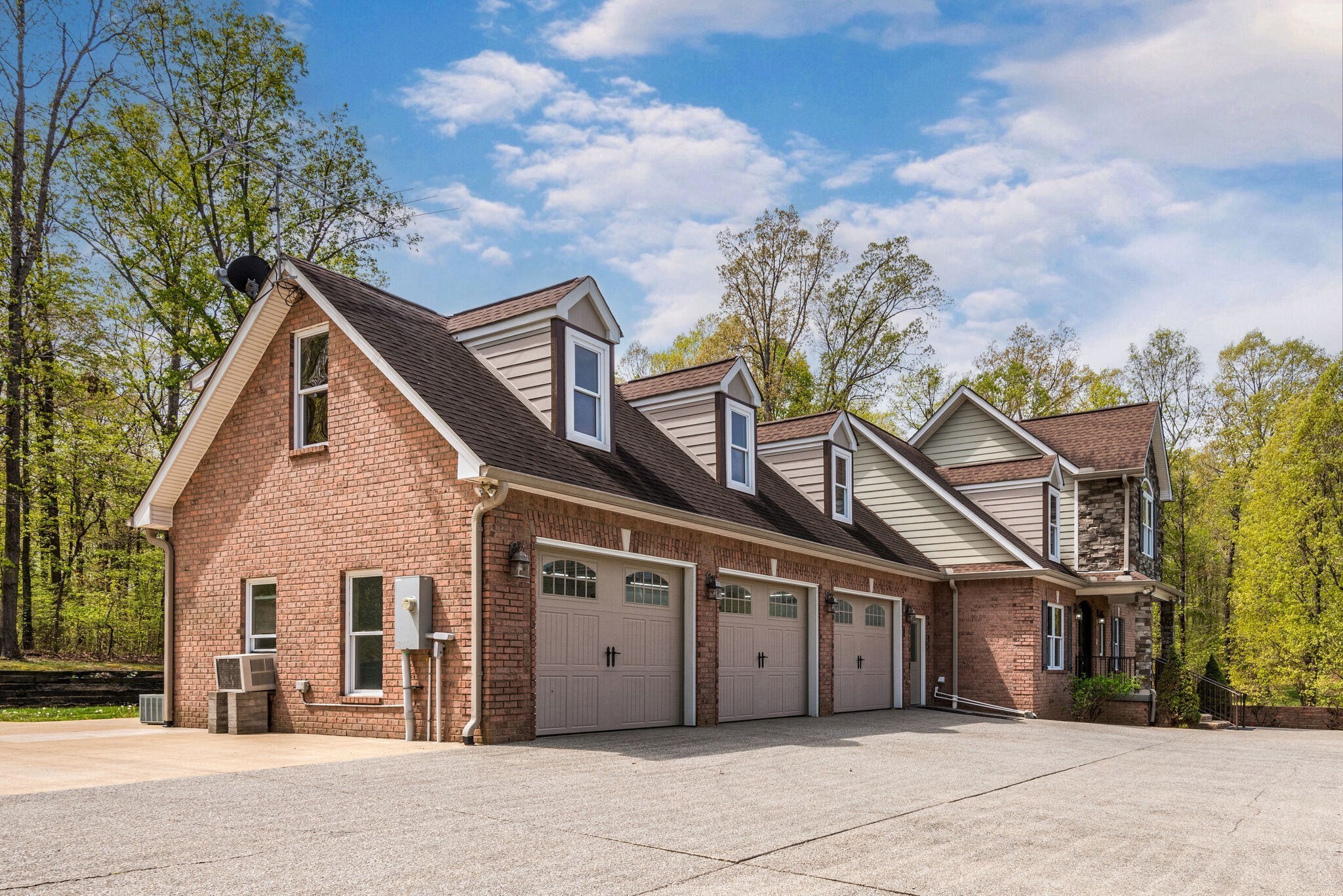 1288 2 Mile Road Burns, TN 37029 - Photo 17 of 70 a view of a house with a large tree and wooden fence