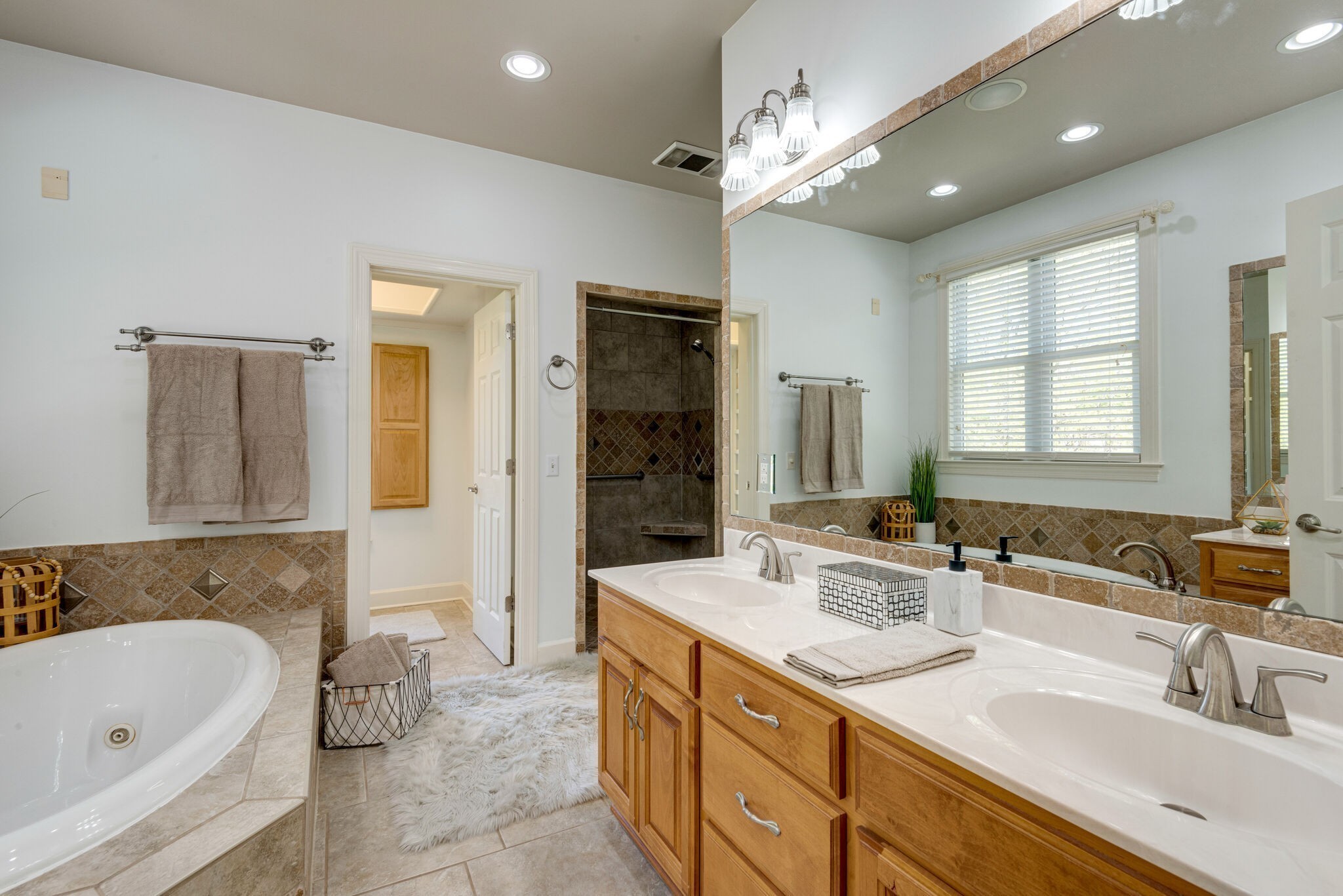 1288 2 Mile Road Burns, TN 37029 - Photo 27 of 70 a bathroom with a sink double vanity granite tub shower and a mirror