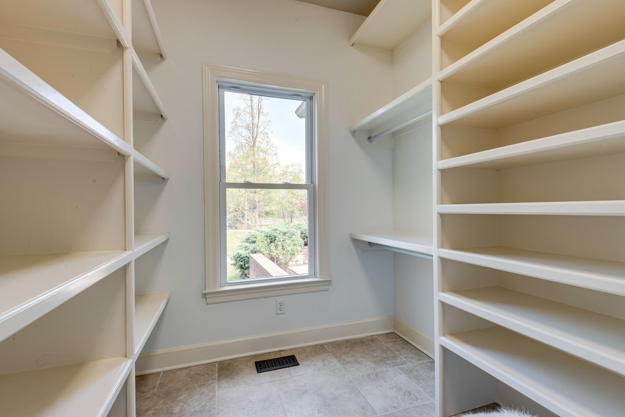 1288 2 Mile Road Burns, TN 37029 - Photo 31 of 70 a view of walk in closet with empty racks
