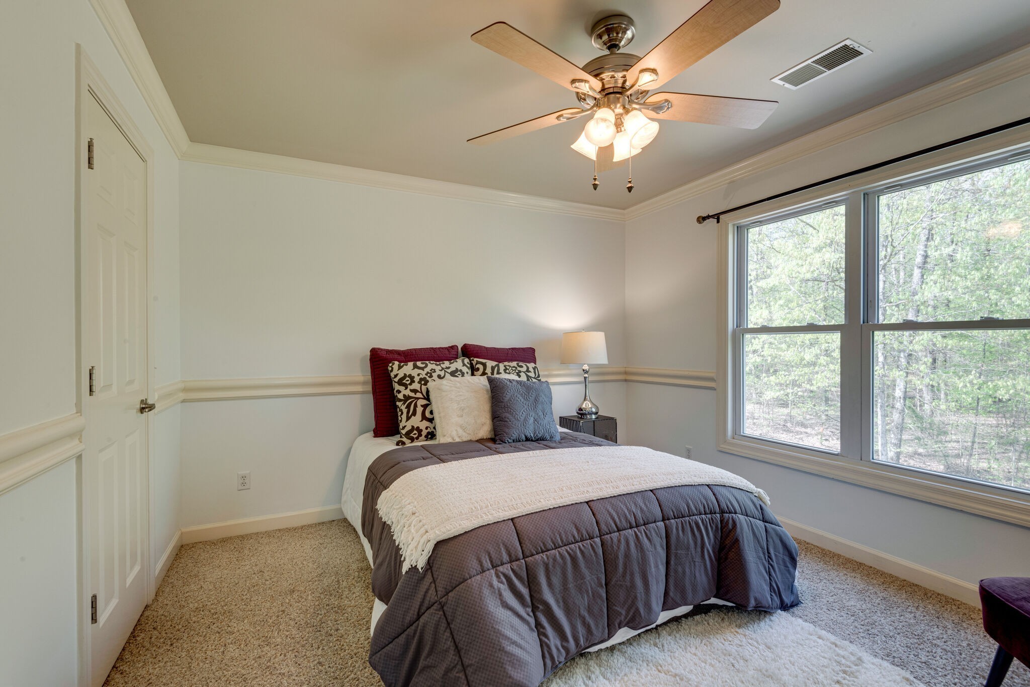 1288 2 Mile Road Burns, TN 37029 - Photo 36 of 70 a bedroom with a large bed and a chandelier