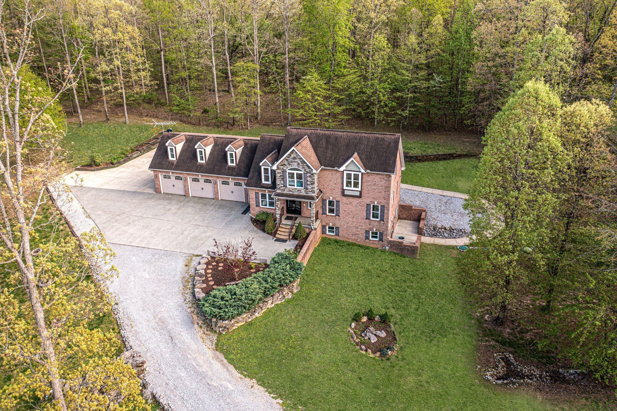 1288 2 Mile Road Burns, TN 37029 - Photo 51 of 70 an aerial view of a house with garden space and trees