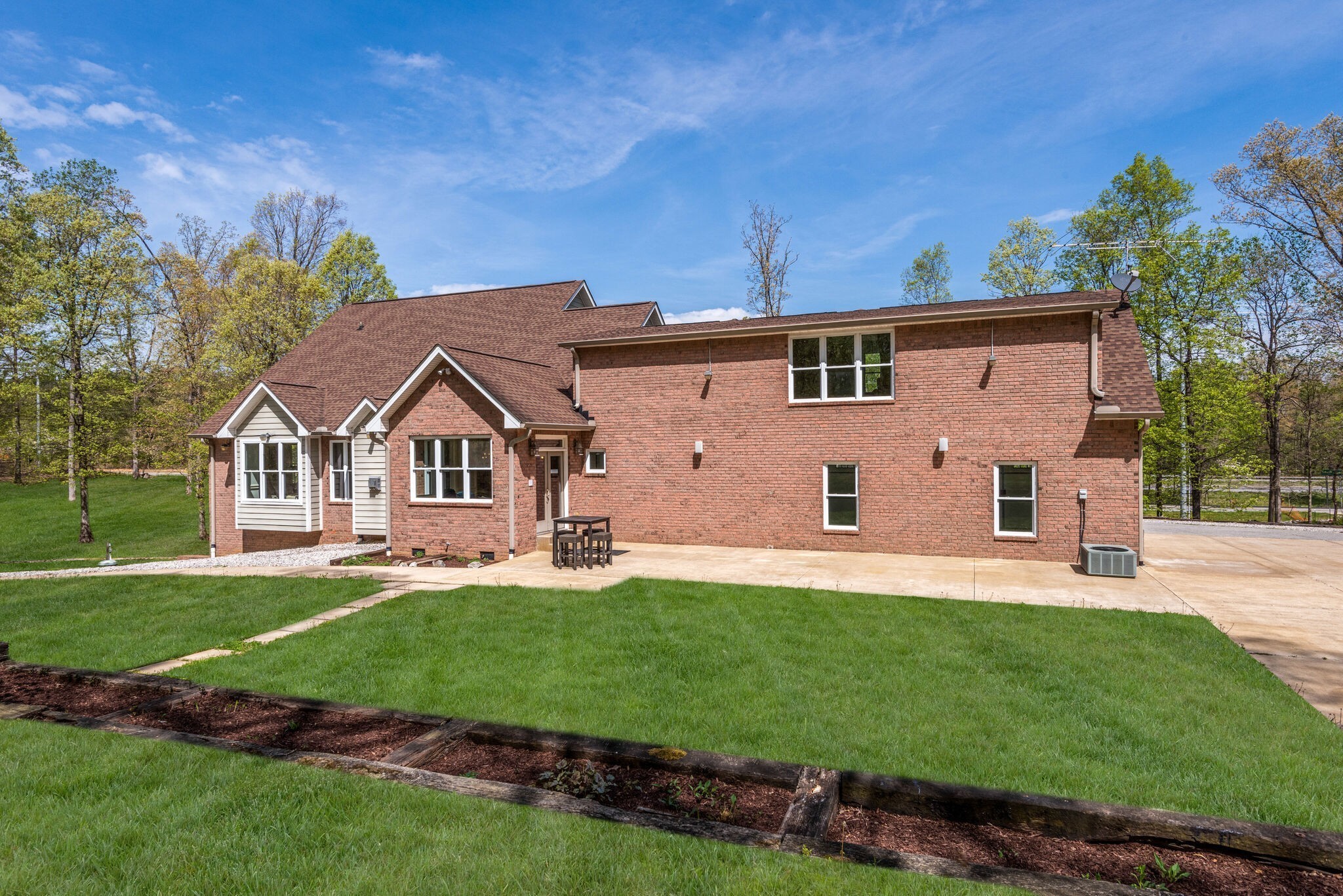 1288 2 Mile Road Burns, TN 37029 - Photo 53 of 70 a front view of a house with a yard and garage