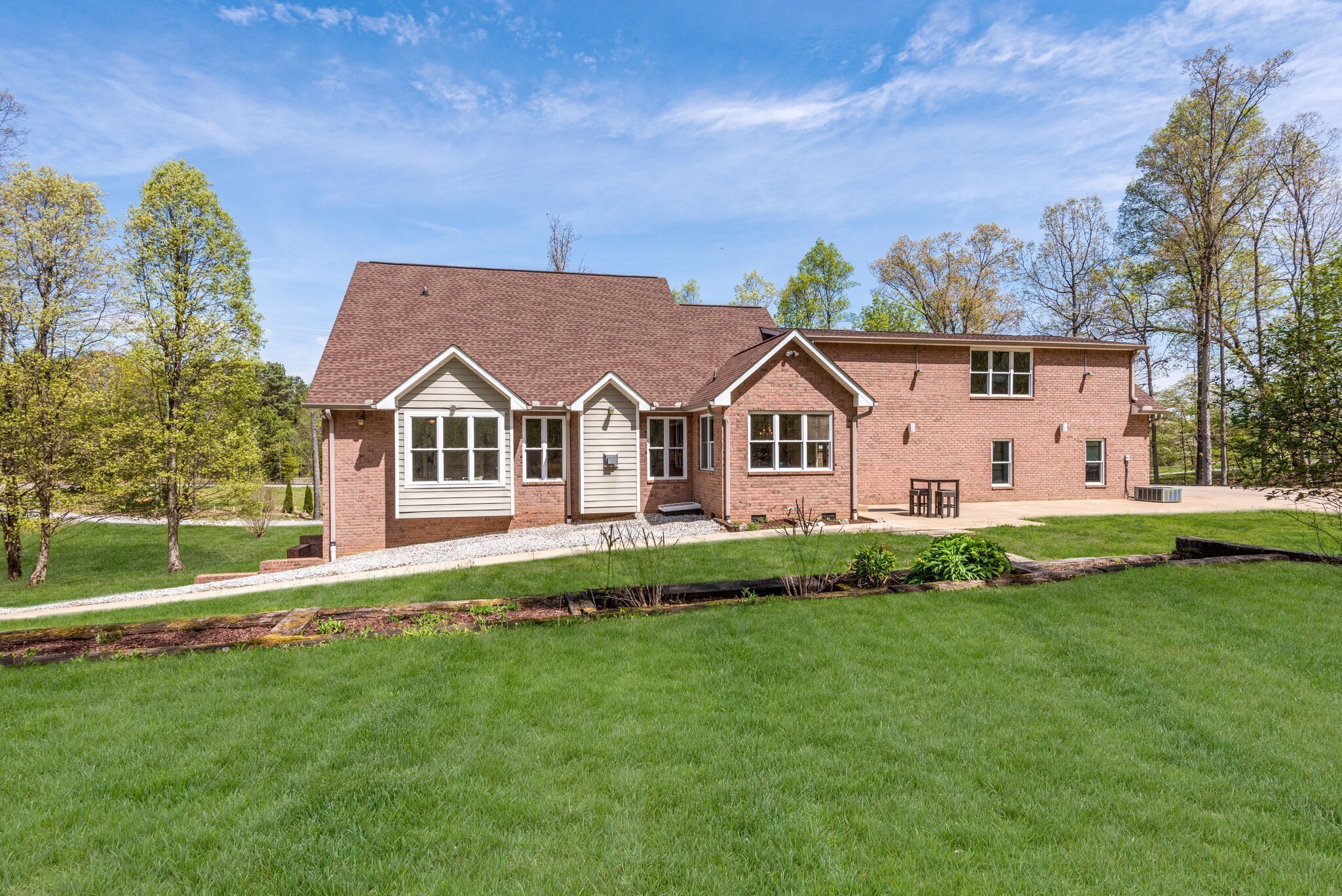 1288 2 Mile Road Burns, TN 37029 - Photo 58 of 70 a view of a white house with a big yard and potted plants