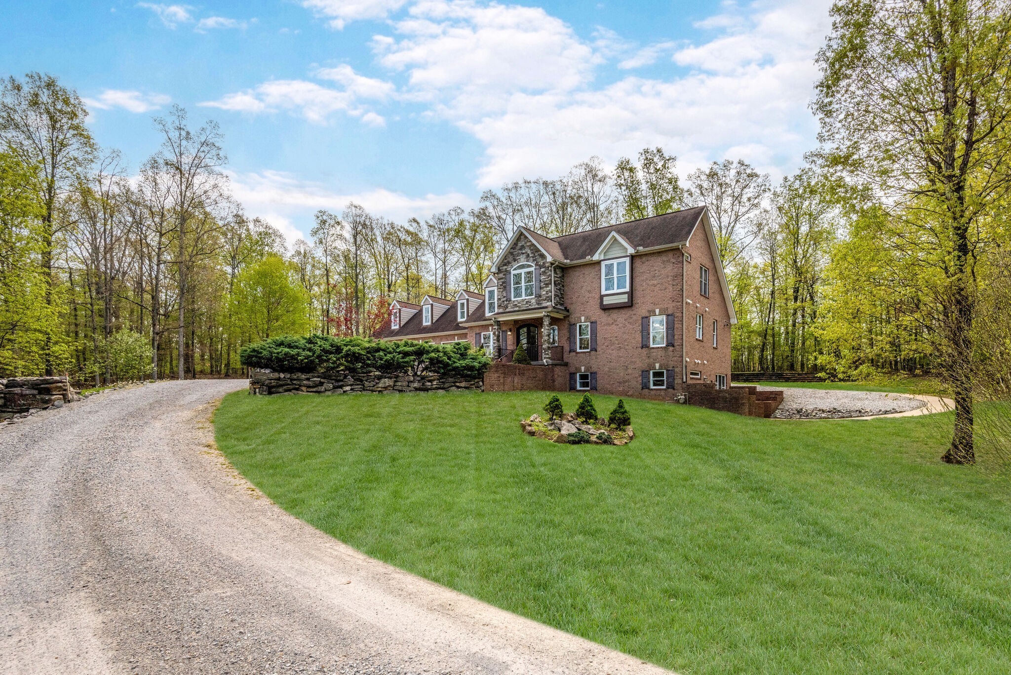 1288 2 Mile Road Burns, TN 37029 - Photo 65 of 70 a view of a house with a big yard and large trees