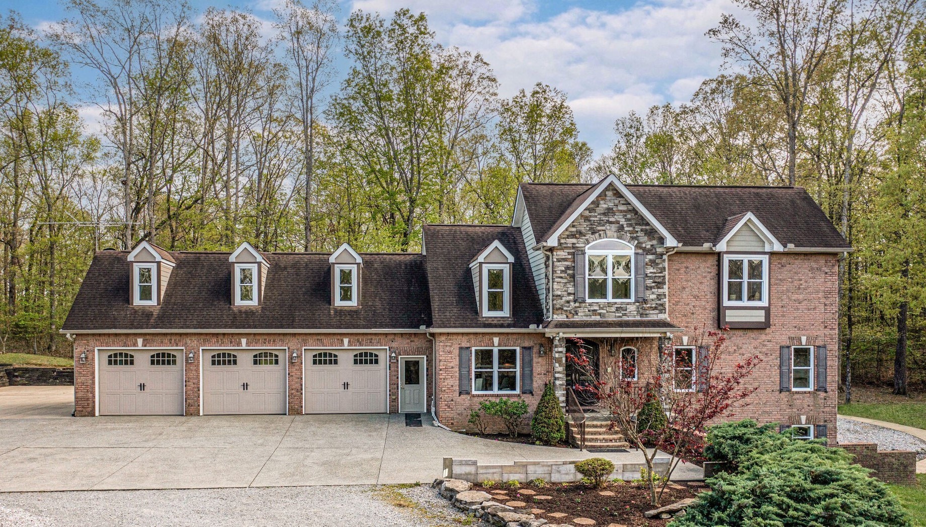 1288 2 Mile Road Burns, TN 37029 - Photo 67 of 70 a front view of a house with trees