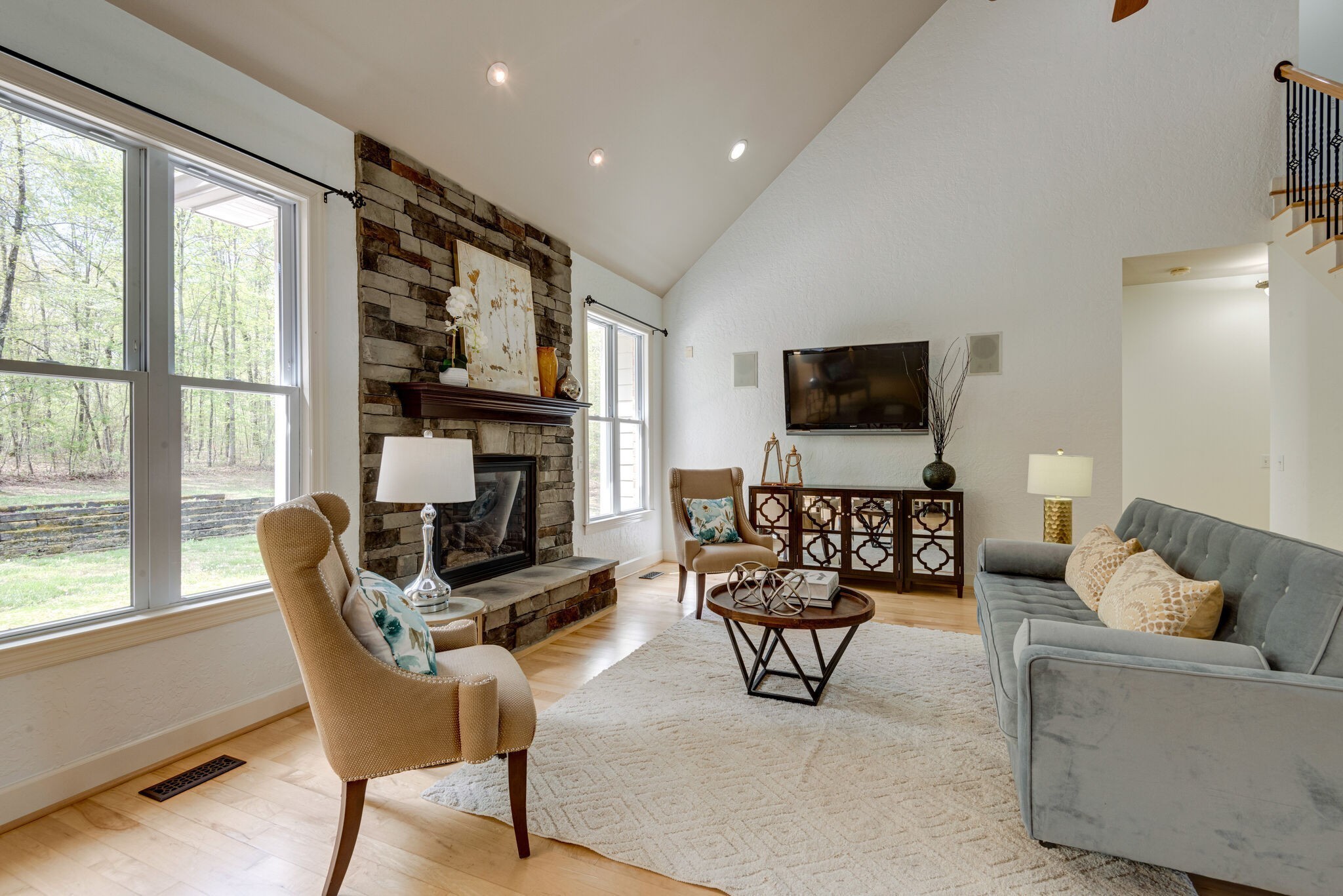 1288 2 Mile Road Burns, TN 37029 - Photo 10 of 70 a living room with furniture a flat screen tv and a large window