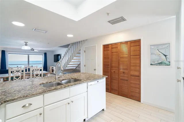 a view of a dining room with furniture wooden floor and chandelier