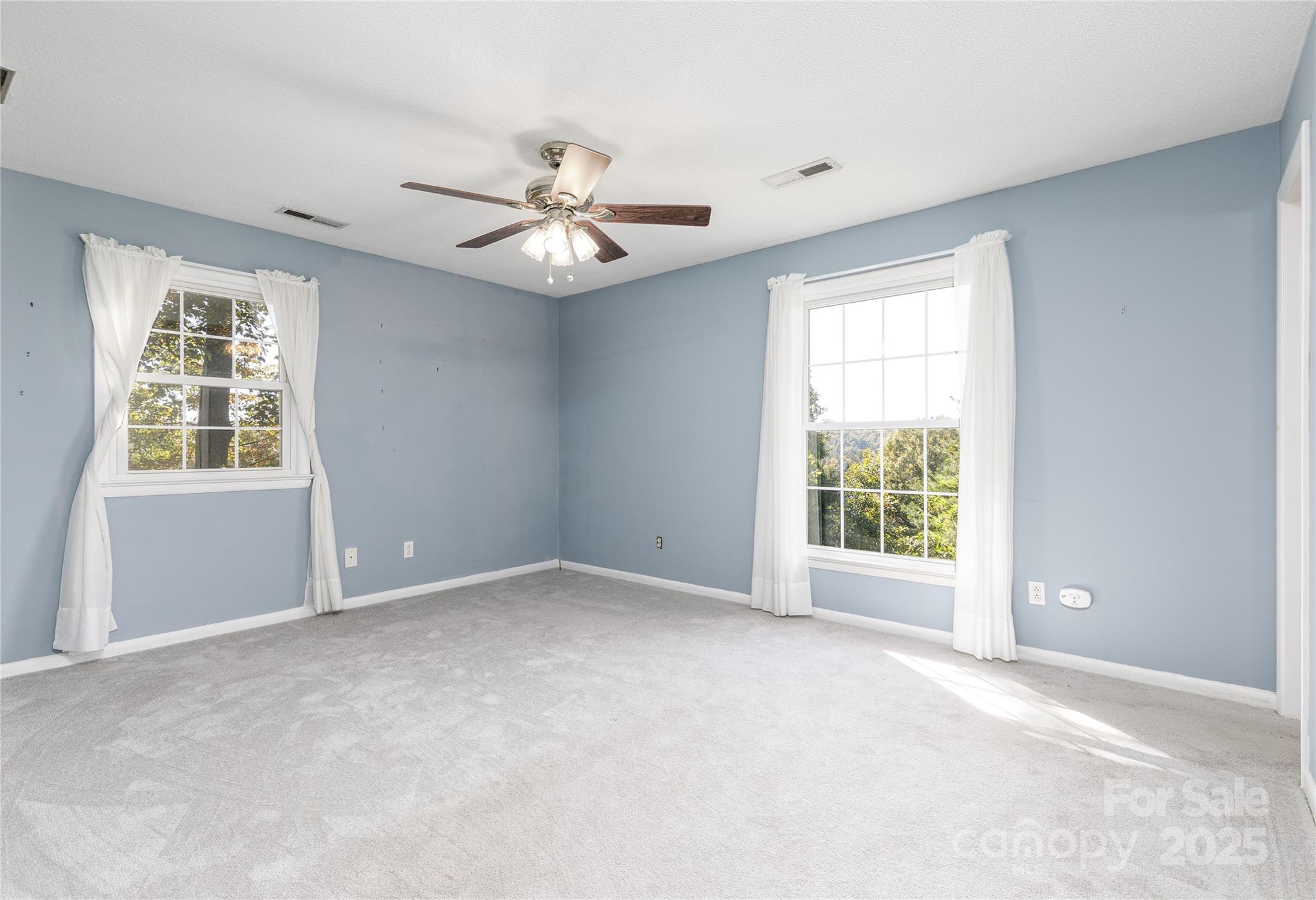 466 Shiloh Church Road Hickory, NC 28601 - Photo 13 of 45 an empty room with windows and ceiling fan