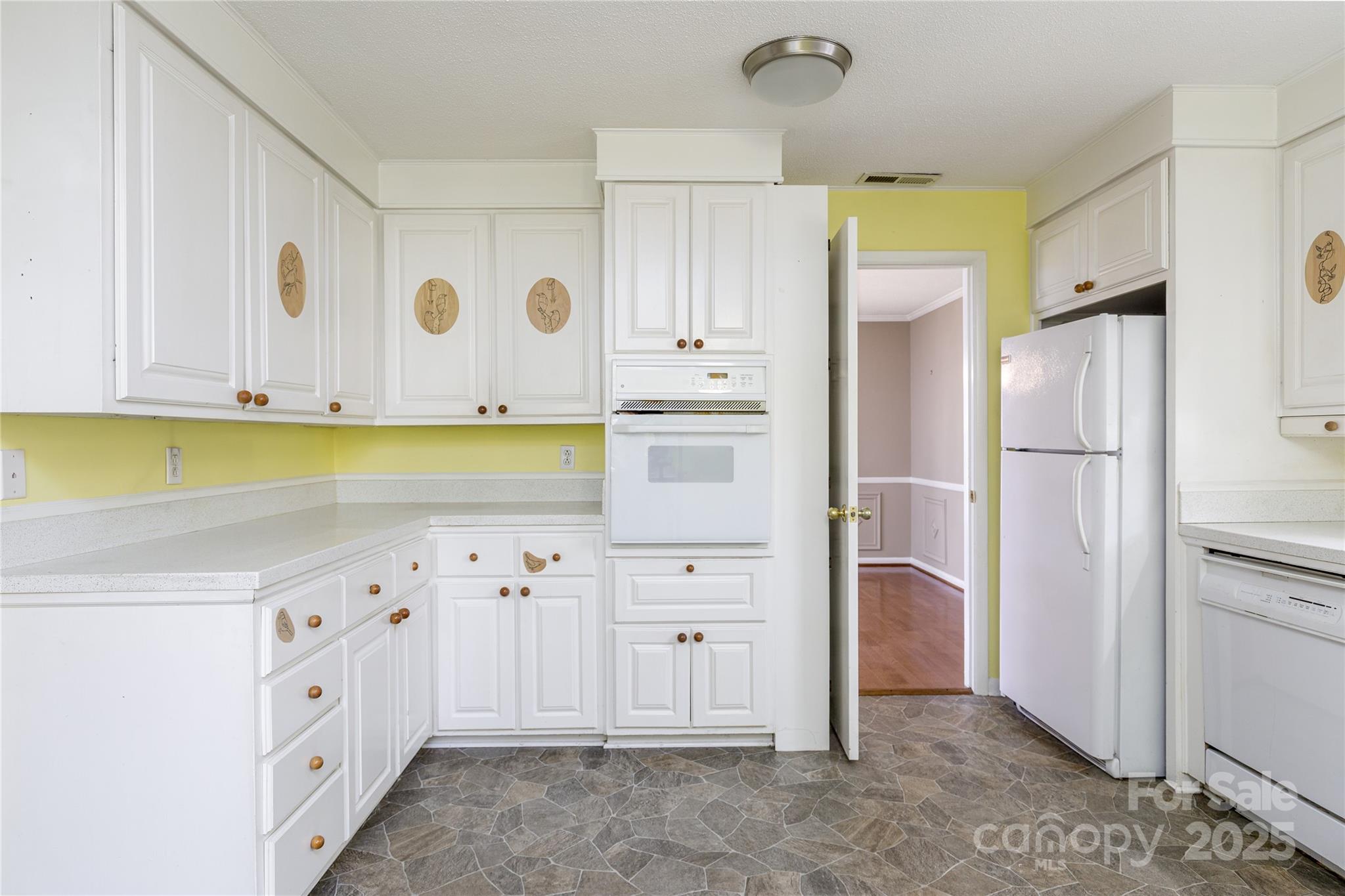 466 Shiloh Church Road Hickory, NC 28601 - Photo 27 of 45 a kitchen with white cabinets and refrigerator