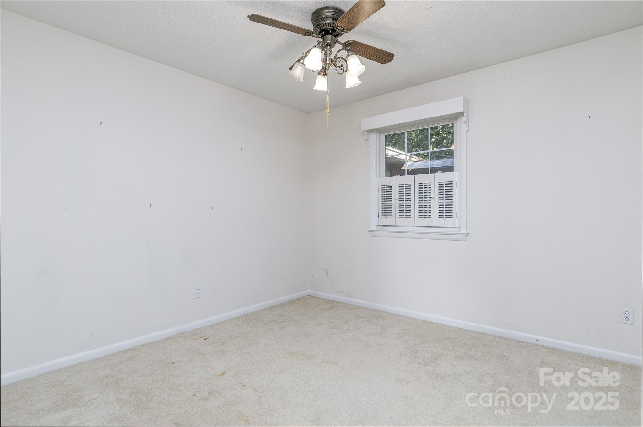 466 Shiloh Church Road Hickory, NC 28601 - Photo 29 of 45 an empty room with a window and a fan