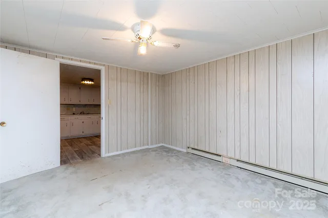a kitchen with cabinets and window