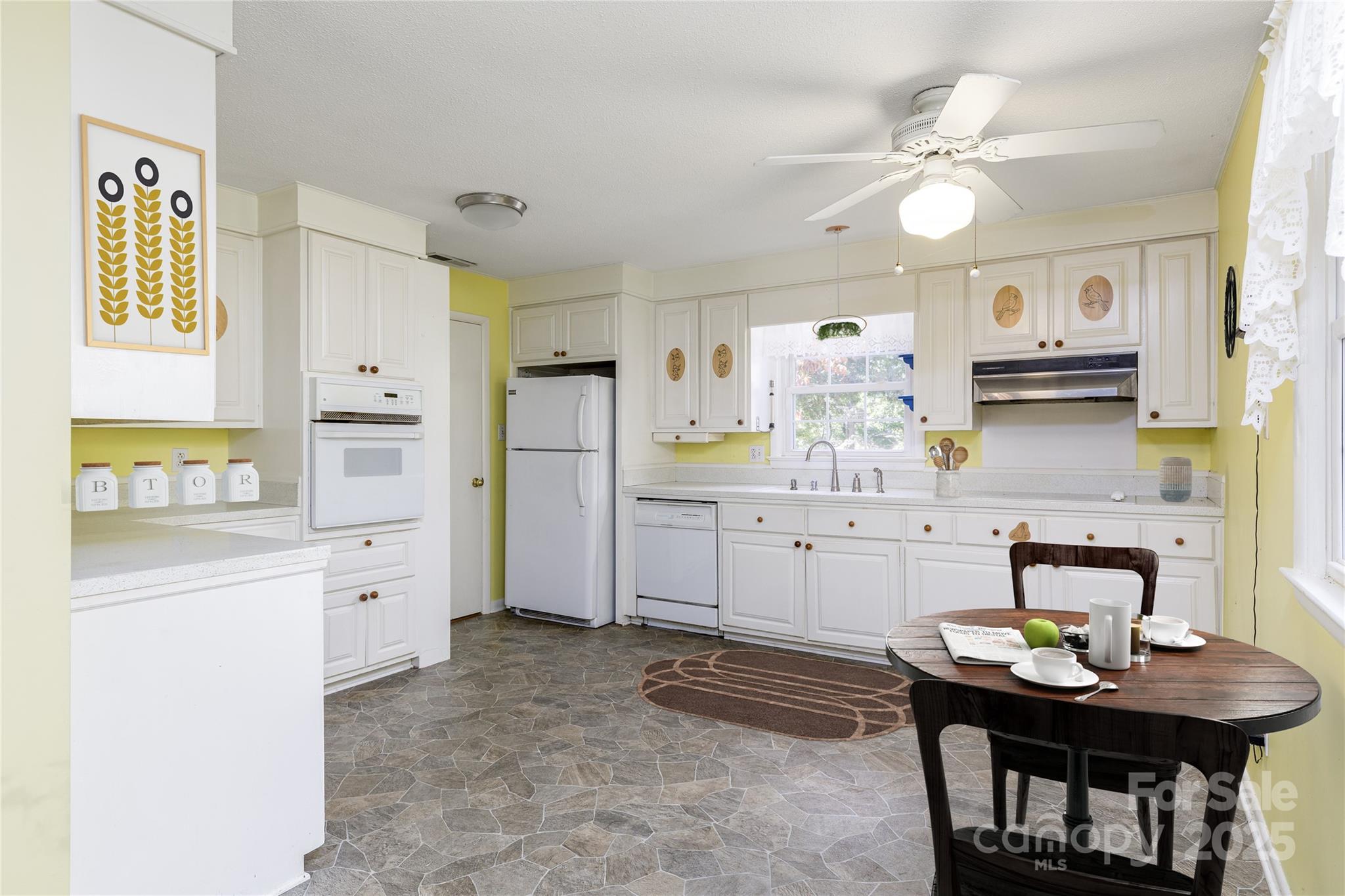 466 Shiloh Church Road Hickory, NC 28601 - Photo 6 of 45 a kitchen with white cabinets and counter space
