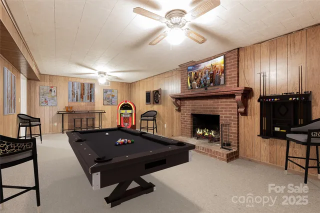 a living room with furniture a table and a fireplace
