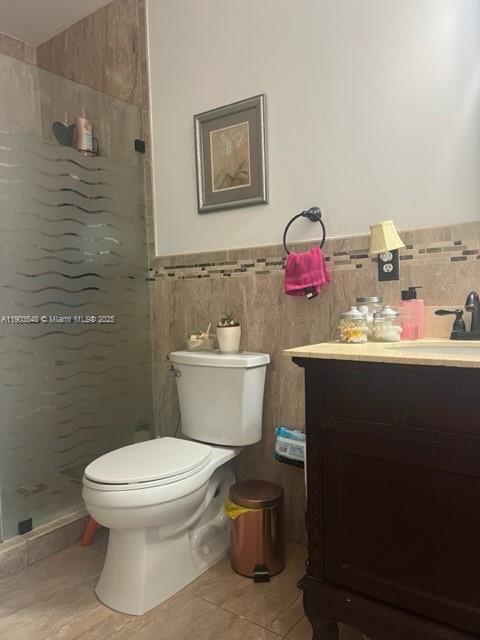 9435 Southwest 156th Place, Unit 9435 Miami, FL 33196 - Photo 9 of 29 a bathroom with a toilet sink vanity and mirror