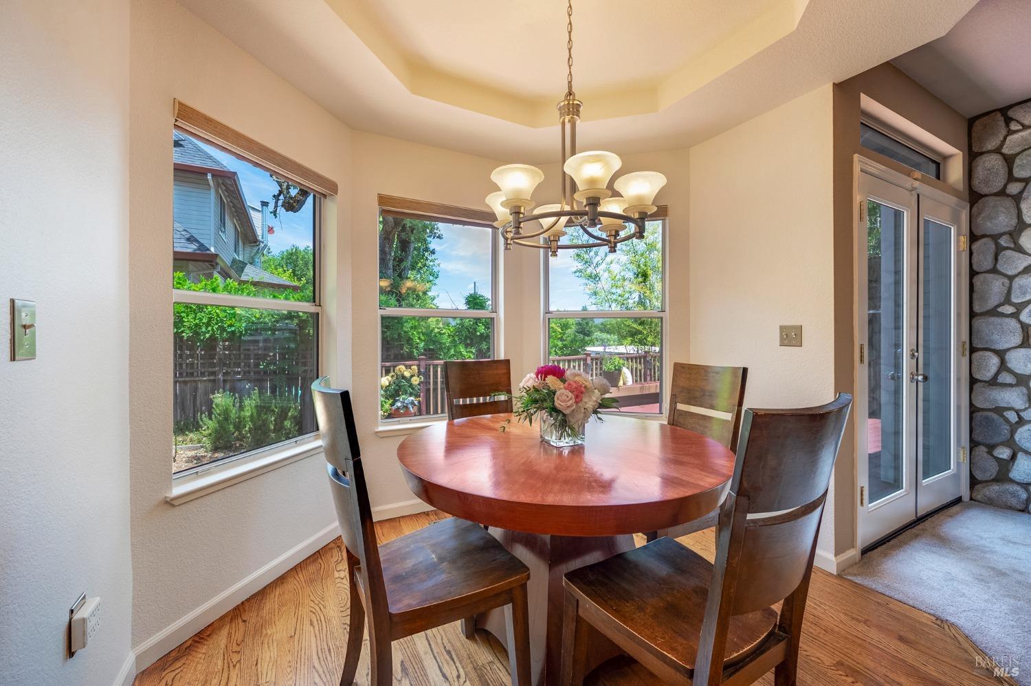 1508 Ronne Drive Santa Rosa, CA 95404 - Photo 14 of 55 a view of a dining room with furniture window and wooden floor