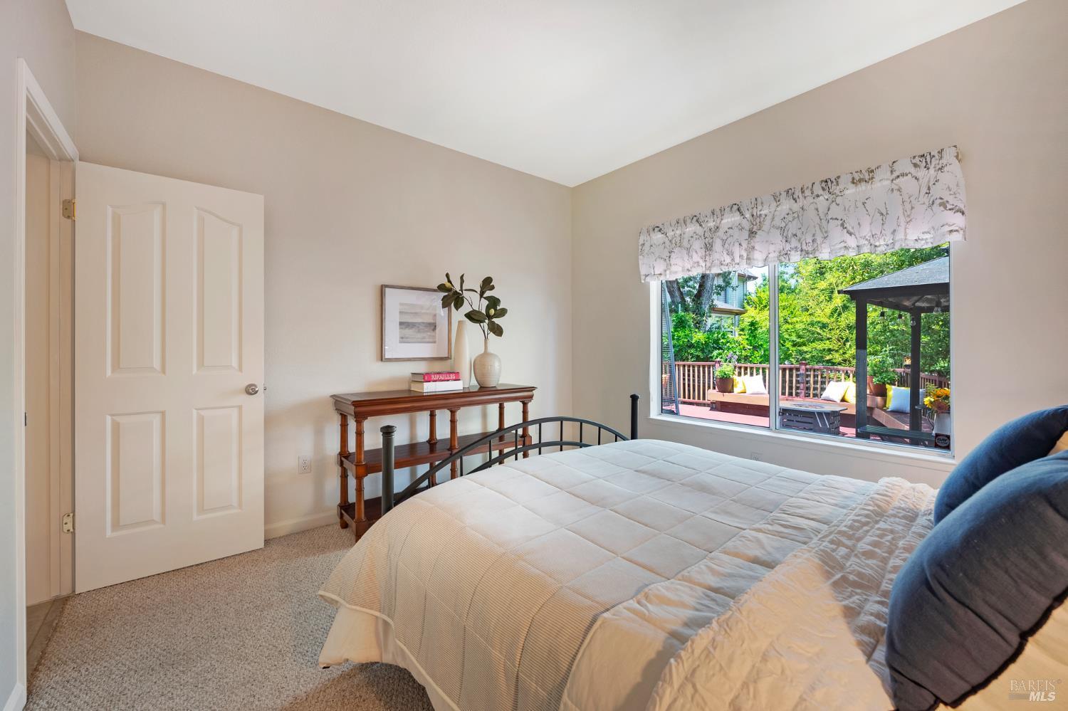 1508 Ronne Drive Santa Rosa, CA 95404 - Photo 19 of 55 a bedroom with a bed and a large window