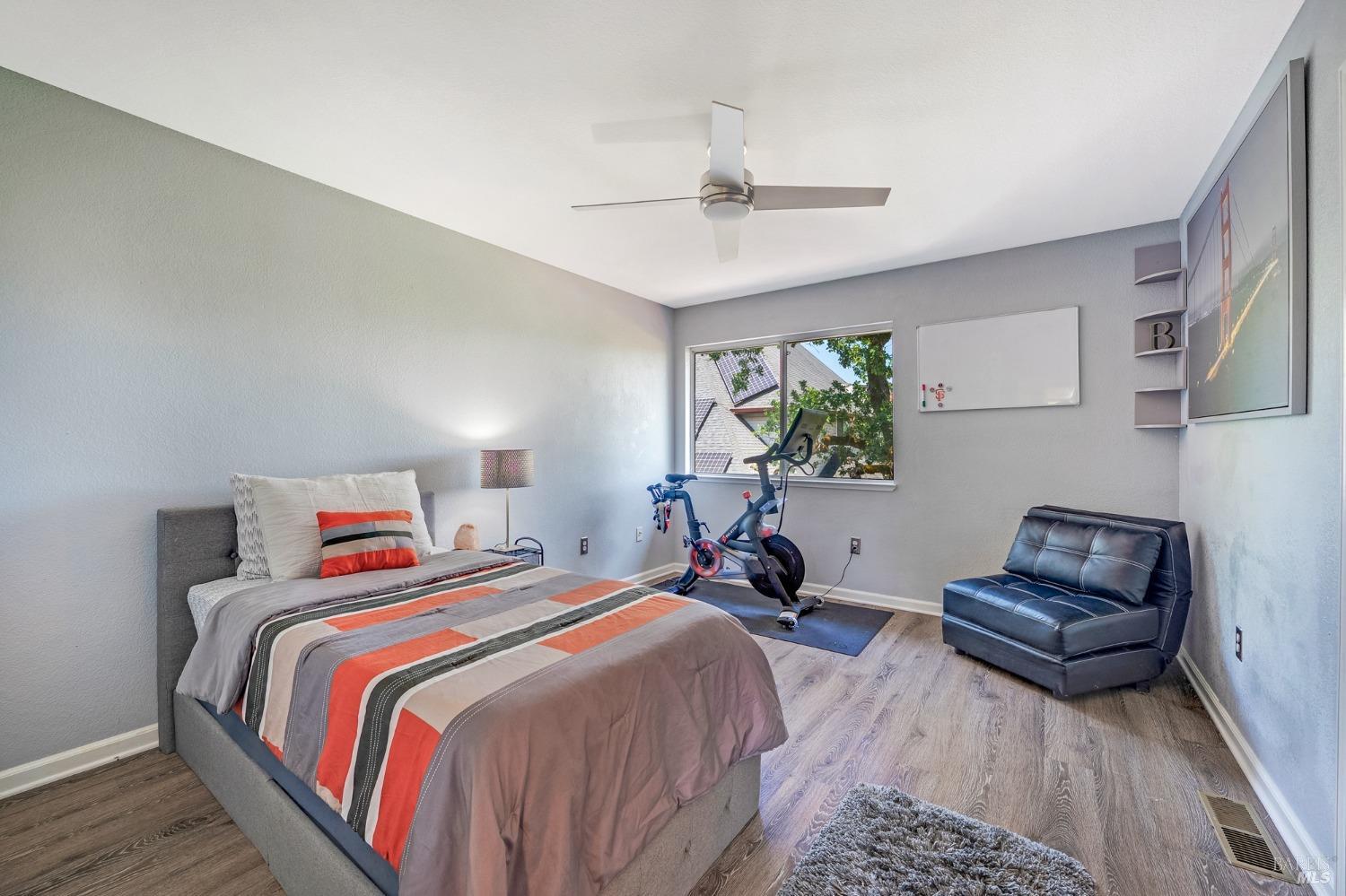 1508 Ronne Drive Santa Rosa, CA 95404 - Photo 32 of 55 a bedroom with a bed and a chandelier