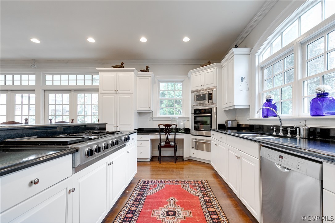 5805 River Road Richmond, VA 23226 - Photo 12 of 47 a large kitchen with stainless steel appliances granite countertop a stove a sink and a microwave