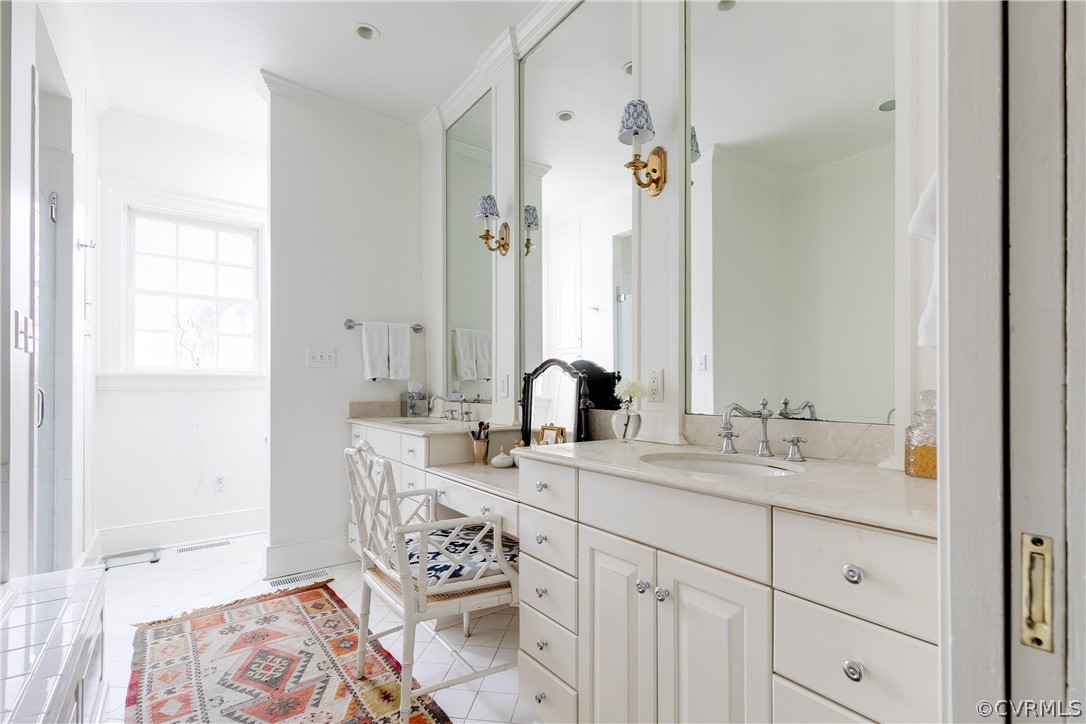 5805 River Road Richmond, VA 23226 - Photo 22 of 47 a bathroom with double vanity sink a mirror and a shower