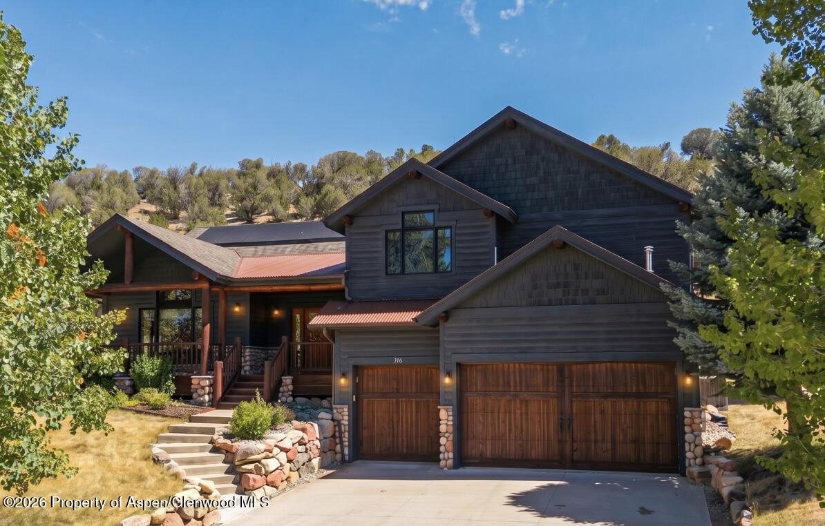 316 Faas Ranch Road New Castle, CO 81647 - Photo 2 of 50 a front view of a house with a yard